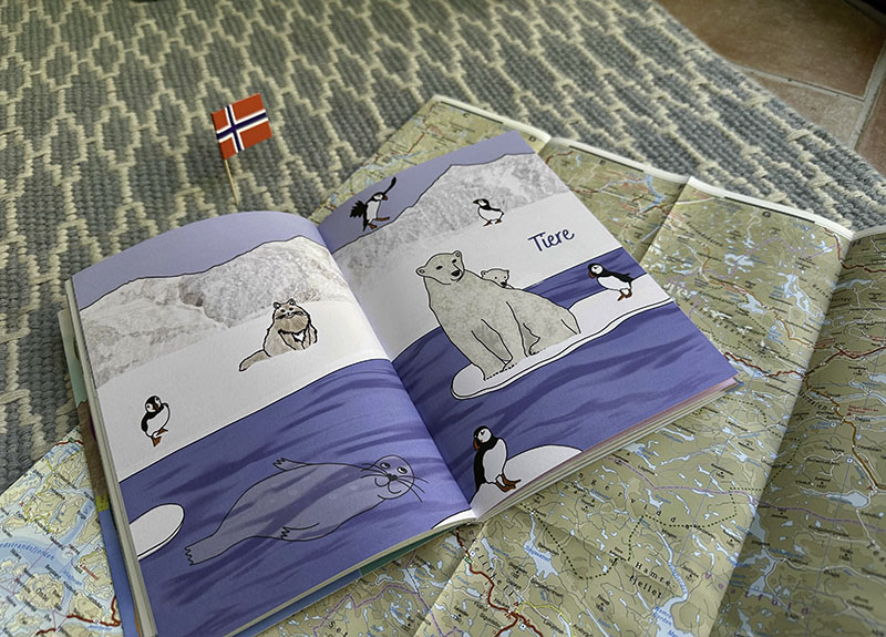 Das Kapitel "Tiere" aus dem norwegischen World for Kids Reiseführer. Im Hintergrund sieht man die norwegische Landkarte.